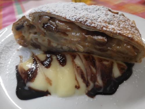 two pieces of cake on a white plate at Hotel Atlantic in Gatteo a Mare