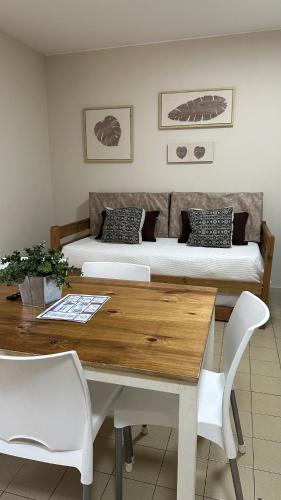 a room with a table and a bed and a desk at Departamentos Rivadavia in Mendoza