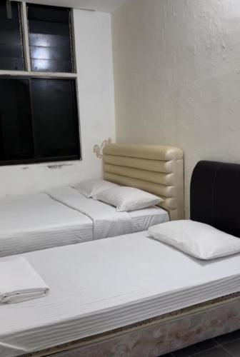 Postel nebo postele na pokoji v ubytování GG 98 Hotel