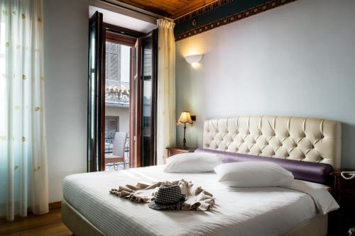 Ένα ή περισσότερα κρεβάτια σε δωμάτιο στο Kyveli Suites
