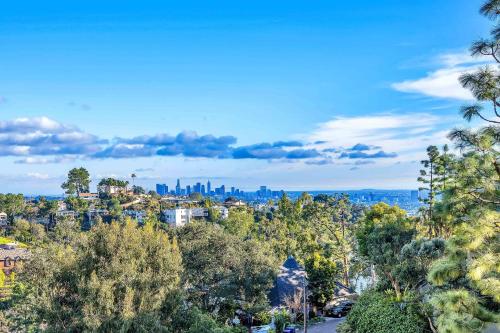 a view of the city from a hill with trees at Secret Stairs Studio #1 in Los Angeles