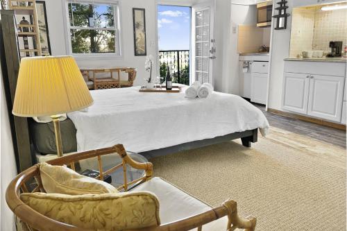 a bedroom with a bed and a table and a chair at Secret Stairs Studio #1 in Los Angeles
