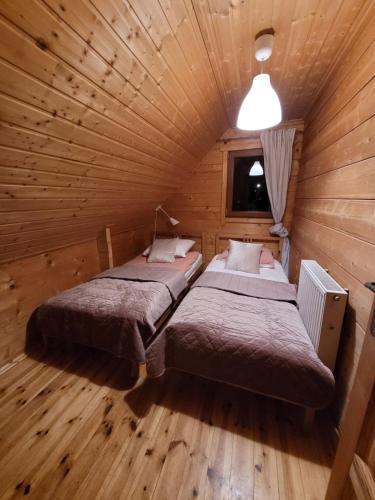 Postel nebo postele na pokoji v ubytování Dom Nad Stawem Dłużec 55A