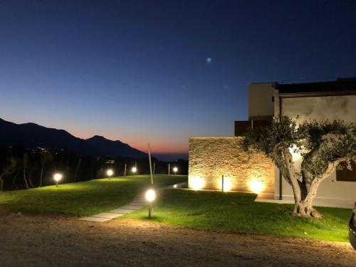 a view of a building at night with lights at Splendida Villa NATURE-APPARTAMENTO MELOGRANO a SCOPELLO-ZINGARO vista sul mare in Scopello