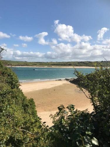 a view of a beach with the ocean at Secluded Luxury Pod with Hot Tub in Launceston