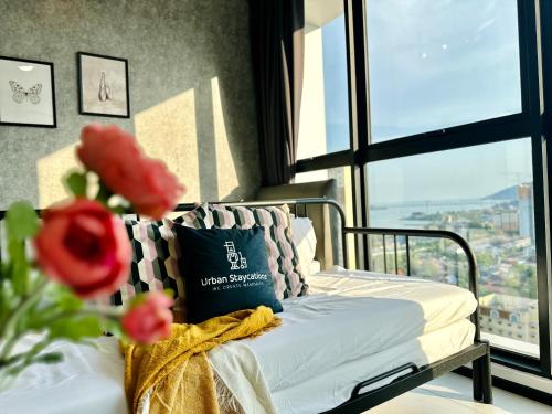 a white couch in a room with a window at New Urban Suite Majestics 3BR Homestay at Georgetown BY URBAN STAYCATION HENG LOD in Jelutong