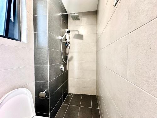 a bathroom with a shower and a toilet at New Urban Suite Majestics 3BR Homestay at Georgetown BY URBAN STAYCATION HENG LOD in Jelutong