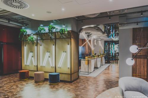 a store with a large window with the letter k on it at Royal Tulip Warsaw Centre in Warsaw