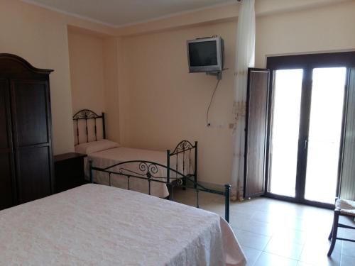 Katil atau katil-katil dalam bilik di La Mortella Agriturismo