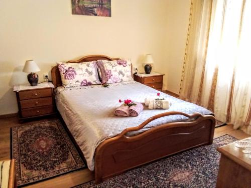 a bedroom with a large bed with two night stands at Tanias Apartment in Siátista