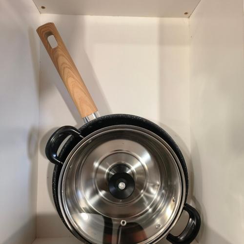 a pot with a wooden spoon sticking out of a wall at New Urban Suite Majestics 3BR Homestay at Georgetown BY URBAN STAYCATION HENG LOD in Jelutong
