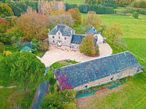 an aerial view of a large house with a roof at Domaine de la Clauzade (Gite) in Saint-Germain-les-Vergnes