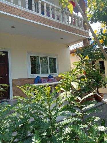 a view of a house from the garden at Wattana Bungalow in Nai Yang Beach