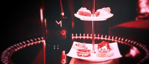 two plates of desserts on a stand with a plate of food at La Suite de l'Elixir in Argentré-du-Plessis