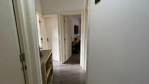 a room with a hallway with a door leading into a room at Single Room near Paddington in London