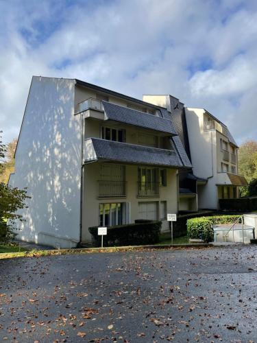 a building on the side of a street at Studio meublé 26m² refait à neuf in Bagnoles de l'Orne