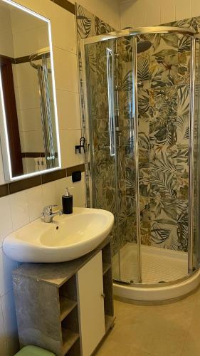 a bathroom with a sink and a shower at La Contessa B&B Torrette in Mercogliano