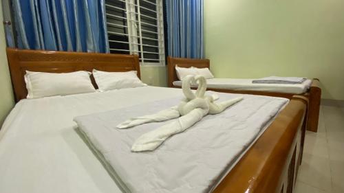 Ένα ή περισσότερα κρεβάτια σε δωμάτιο στο Hotel Bình An