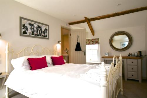 Ένα ή περισσότερα κρεβάτια σε δωμάτιο στο Carew Inn