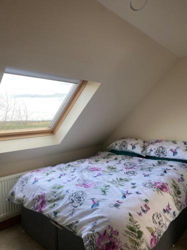 a bedroom with a bed and a window at Tewit Castle Adventures in Eryholme