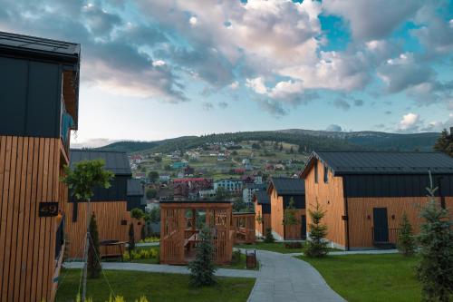 a view of a town with houses and a city at Phoenix Relax Park in Bukovel