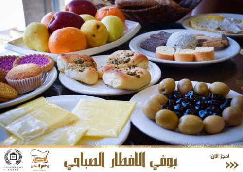 a table topped with plates of different types of pastries at Al-Sadier Place Hotel & Restaurant in Baghdad