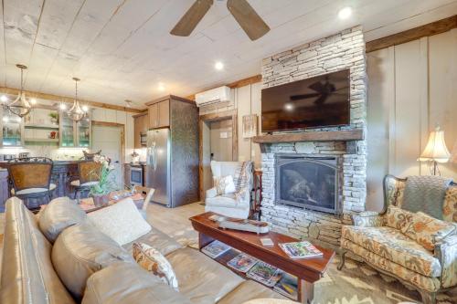 a living room with a couch and a fireplace at 1 Mi to Beech Mtn Cabin with Fire Pit and BBQ! in Beech Mountain