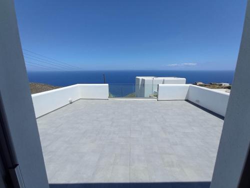 a view of the ocean from the balcony of a house at Seascape, apartment with sea view 1 in Ano Meria