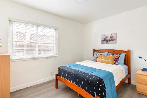 a bedroom with a bed and a window at Newly Renovated 2BR 1BA Near San Jose Downtown up to 20 percent off in San Jose