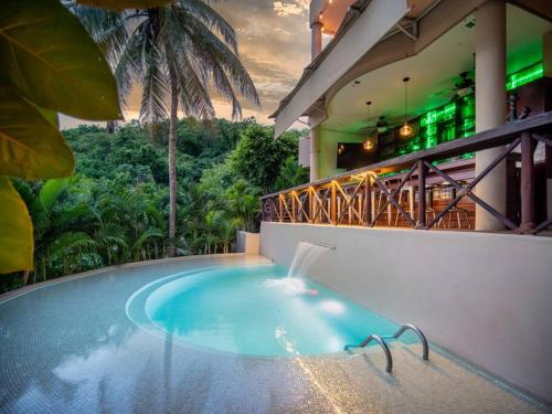 a swimming pool in the middle of a building at Casa Maka - Stunning Oceanfront Villa in Santa Cruz Huatulco