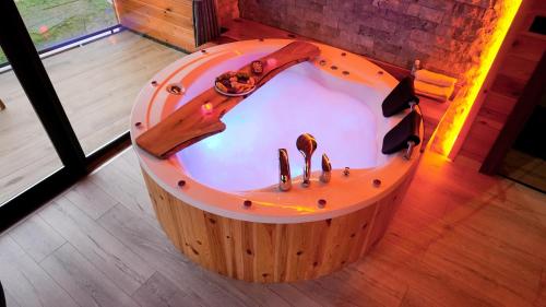 a jacuzzi tub in the middle of a room at Lotus Çamlıhemşin Suit & Bungalov in Çamlıhemşin