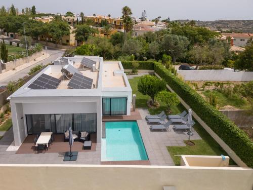 an aerial view of a house with solar panels on it at Bela Vista da Luz 17 by Destination Algarve in Luz