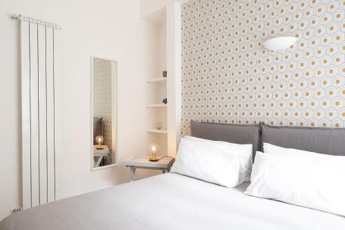 Postel nebo postele na pokoji v ubytování San Liborio Suites