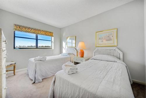 Postel nebo postele na pokoji v ubytování Arcadian One 04a