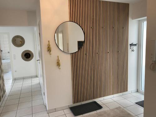 a bathroom with a mirror on the wall at Am Kienbusch - Erdgeschoss in Annweiler am Trifels