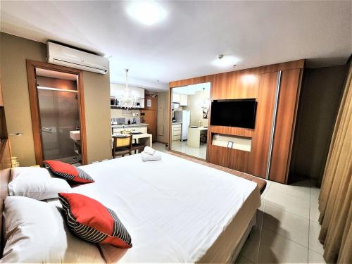 Bloco A AP 310 · Hotel Jade, Park Sul vista livre tesisinde bir odada yatak veya yataklar
