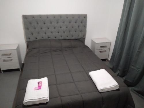 เตียงในห้องที่ Alojamiento laura