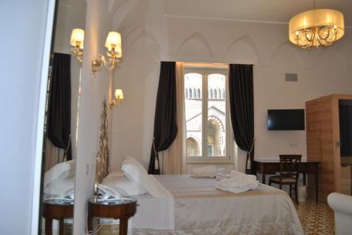 a hotel room with a bed and a window at Core Amalfitano City Suites in Amalfi