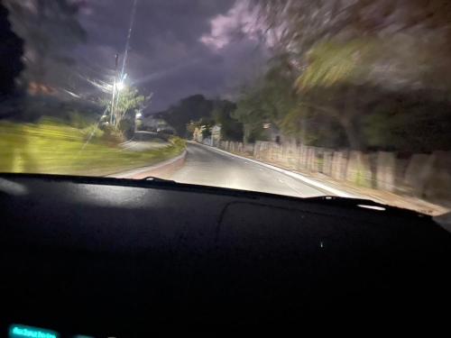a view from a car windshield of a road at Vangau in Esquipulas