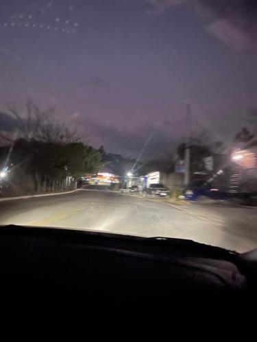 a view from a car window of a street at night at Vangau in Esquipulas