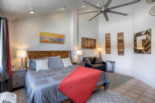 a bedroom with a bed with a red blanket on it at Tamarron Lodge Suite 502 in Durango