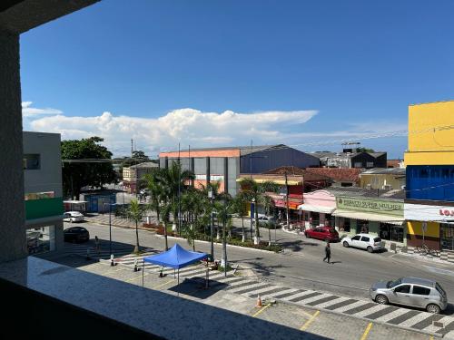 a view of a city with a street with cars at Condomínio Kaimã in Matinhos