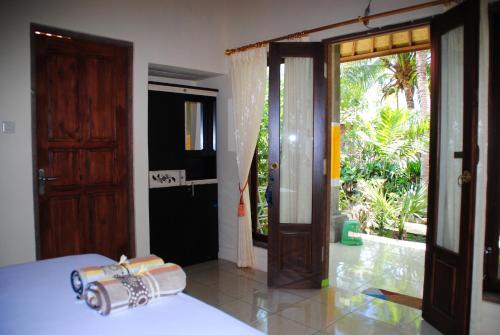 Voodi või voodid majutusasutuse Kubu Sari Guest House toas