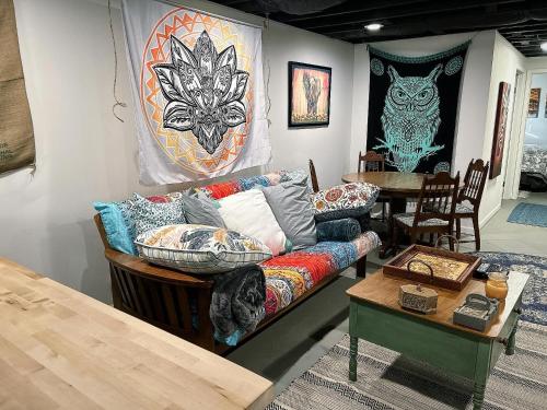 a living room with a couch and a table at The Treasure House in Smyrna