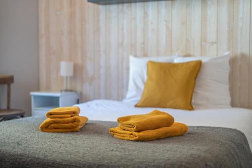Postel nebo postele na pokoji v ubytování Hotel Le Beau Site
