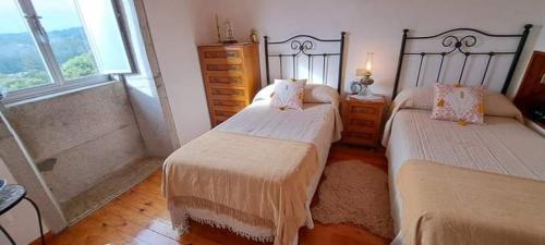 Postel nebo postele na pokoji v ubytování Villa Gondomil