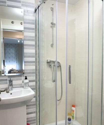 a bathroom with a shower and a sink at APARTAMENTOS LONCHO CEE in Cee