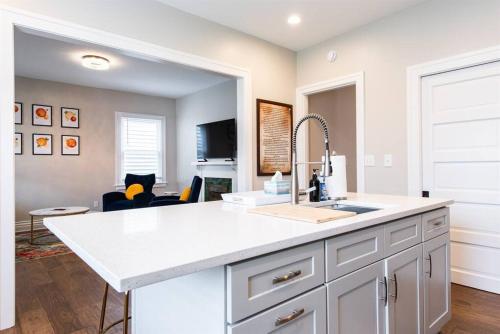 a kitchen with a sink and a counter top at 2BR Haven: Remodeled Gem! in Louisville