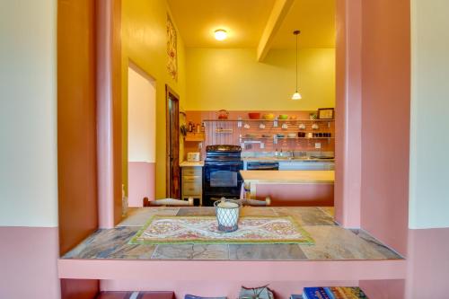 a kitchen with a table with a vase on it at Cozy Ridgway Vacation Rental Hike, Ski and Explore! in Ridgway