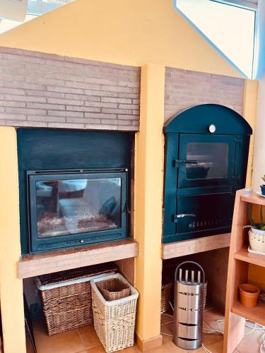 a toy play house with a fireplace in it at Chalet La Calma en Lorca in Lorca
